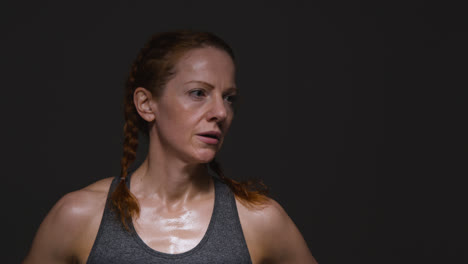 Studio-Shot-Of-Mature-Woman-Wearing-Gym-Fitness-Clothing-Doing-Cardio-Exercise-Running-On-The-Spot